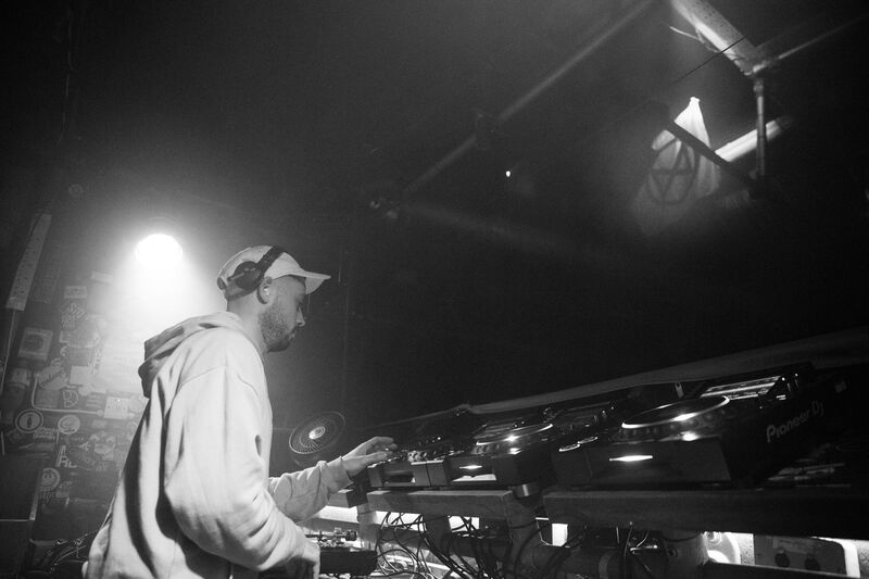 Theon Bower mixing on CDJs, black and white